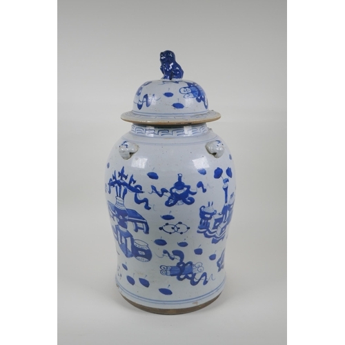 35 - An early C20th Chinese blue and white porcelain jar and cover with four lion mask handles, a Fo-dog ... 