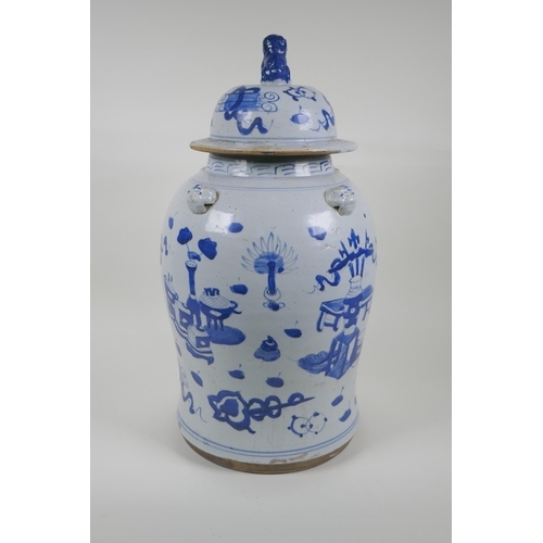 35 - An early C20th Chinese blue and white porcelain jar and cover with four lion mask handles, a Fo-dog ... 