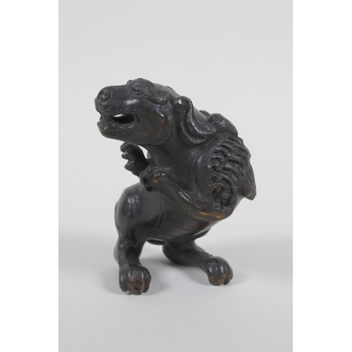 40 - A Chinese bronze figure of a winged mythical beast, 10cm high