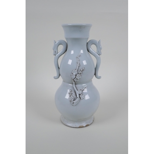 49 - A blanc de chine porcelain two handled double gourd vase with raised prunus blossom decoration, impr... 