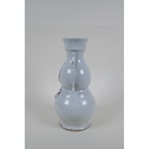 49 - A blanc de chine porcelain two handled double gourd vase with raised prunus blossom decoration, impr... 