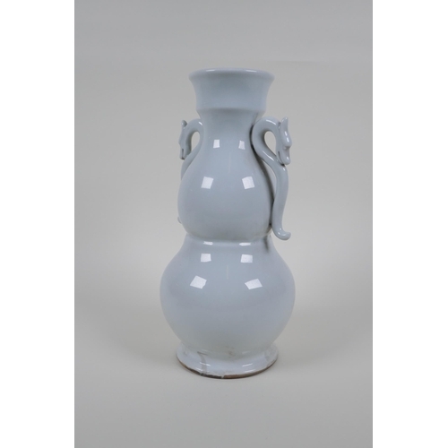 49 - A blanc de chine porcelain two handled double gourd vase with raised prunus blossom decoration, impr... 