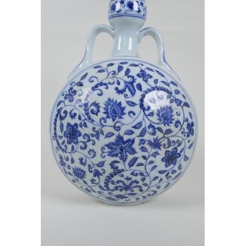 62 - A blue and white moon flask with two handles and scrolling floral decoration, Chinese Xuande 6 chara... 