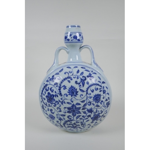 62 - A blue and white moon flask with two handles and scrolling floral decoration, Chinese Xuande 6 chara... 