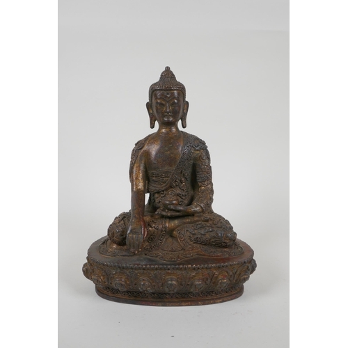 66 - A Tibetan gilt bronze figure of Buddha seated in meditation, impressed double vajra mark to base, 22... 