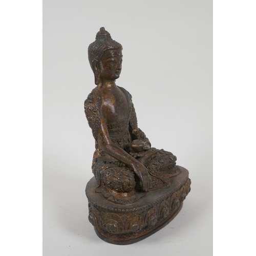 66 - A Tibetan gilt bronze figure of Buddha seated in meditation, impressed double vajra mark to base, 22... 