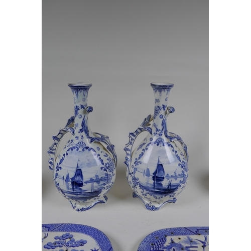 69 - A pair of Delft Royal Bonn porcelain vases with two handles, together with two Delft slender necked ... 