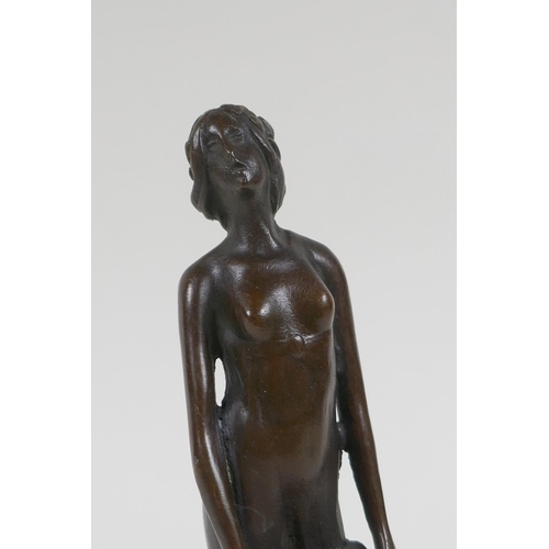 71 - An Art Nouveau style bronze figure of a woman carrying a tray, 19cm high