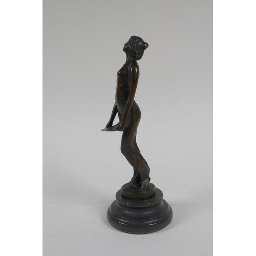 71 - An Art Nouveau style bronze figure of a woman carrying a tray, 19cm high