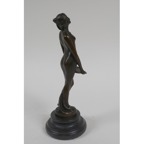 71 - An Art Nouveau style bronze figure of a woman carrying a tray, 19cm high