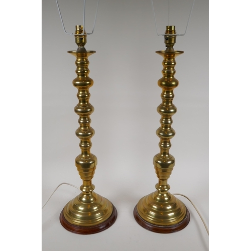 72 - A pair of spun brass table lamps, 57cm high