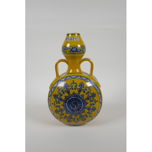 80 - A Chinese yellow ground porcelain moon flask with garlic head shaped neck, two handles and blue and ... 