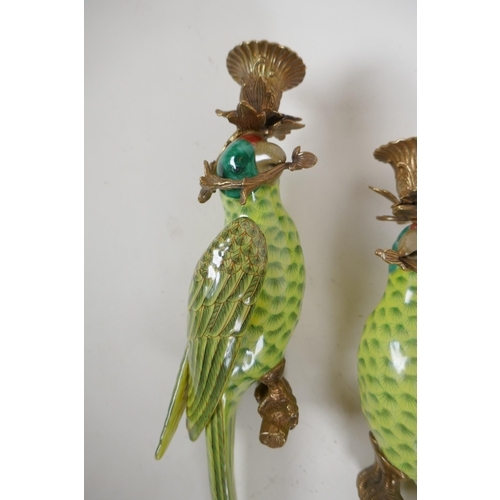 81 - A pair of polychrome porcelain and ormolu mounted parrot wall sconces, 48cm high