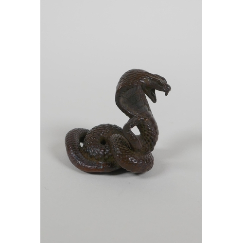 88 - A Japanese style bronze okimono cobra, seal mark to base, 4cm high