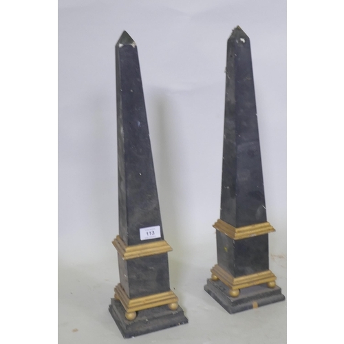 113 - A pair of painted wood and parcel gilt obelisks, 55cm high