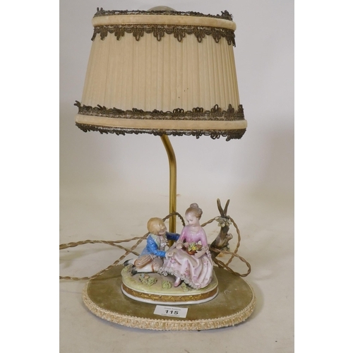 115 - A continental porcelain table lamp, 37cm high with shade