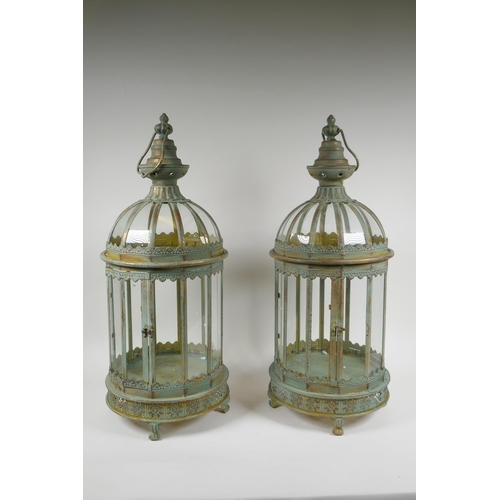 117 - A pair of domed topped metal lanterns with distressed gilt and ver de gris patina, 60cm high