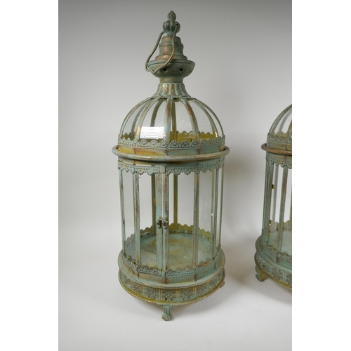 117 - A pair of domed topped metal lanterns with distressed gilt and ver de gris patina, 60cm high