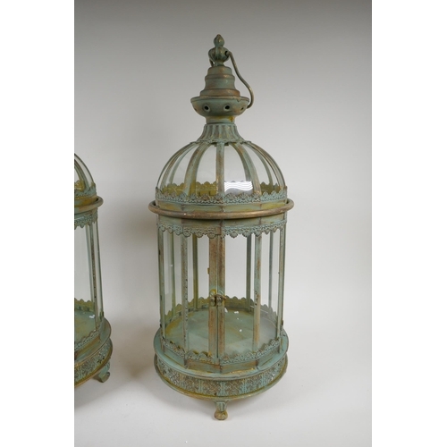 117 - A pair of domed topped metal lanterns with distressed gilt and ver de gris patina, 60cm high