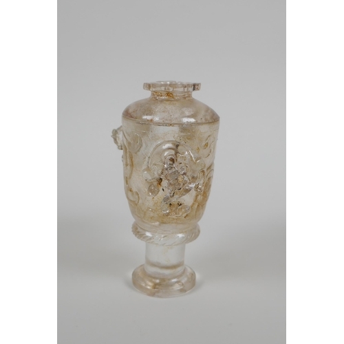 119 - A Chinese glass libation cup and cover with dragon and kylin decoration, 12cm high