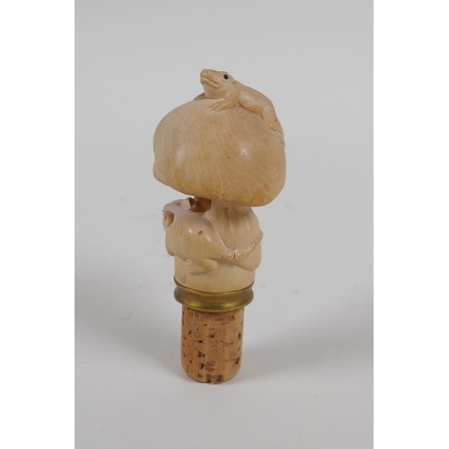 122 - A carved boxwood bottle stopper in the form of mushrooms, toad and rat, 10cm