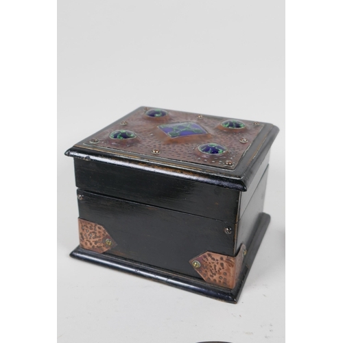 141 - An Arts & Crafts copper mounted ebonised wood card box with inset enamel panels, an Art Nouveau ... 