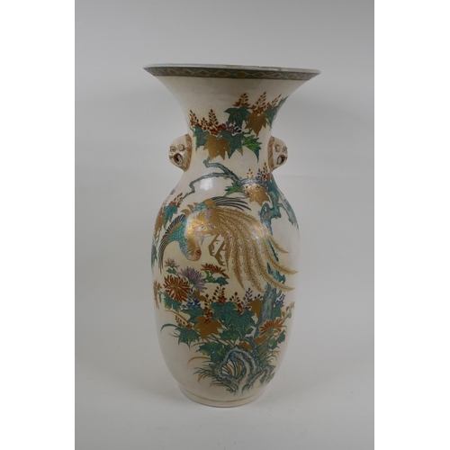 60 - A Japanese Meiji Satsuma vase, with twin mask handles, decorated with a phoenix in flight, 48cm high