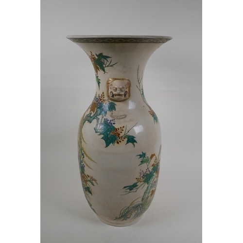 60 - A Japanese Meiji Satsuma vase, with twin mask handles, decorated with a phoenix in flight, 48cm high