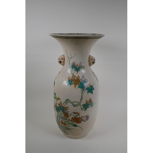 60 - A Japanese Meiji Satsuma vase, with twin mask handles, decorated with a phoenix in flight, 48cm high