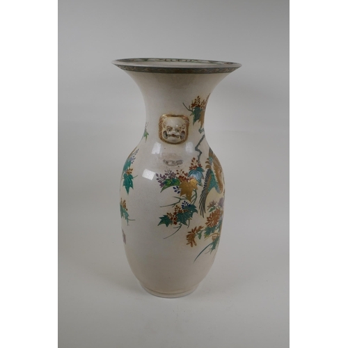 60 - A Japanese Meiji Satsuma vase, with twin mask handles, decorated with a phoenix in flight, 48cm high