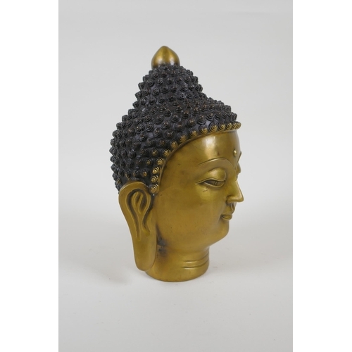 145 - A Chinese filled head bust of Buddha, character mark to base, 22cm high