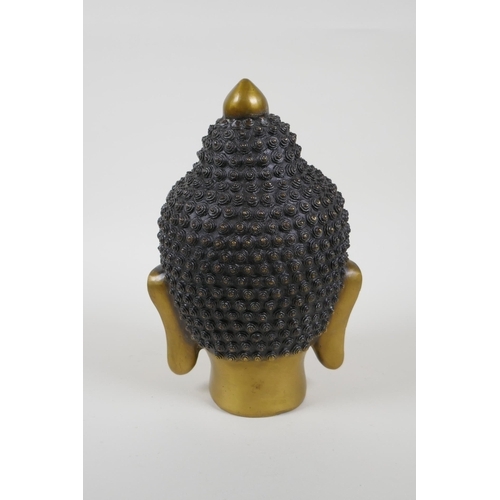 145 - A Chinese filled head bust of Buddha, character mark to base, 22cm high