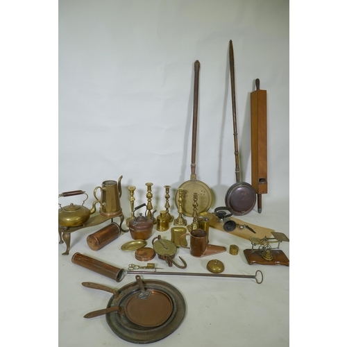 178 - A quantity of copper and brass, footman skillets, candlesticks, bed warmers, set of postage scales w... 