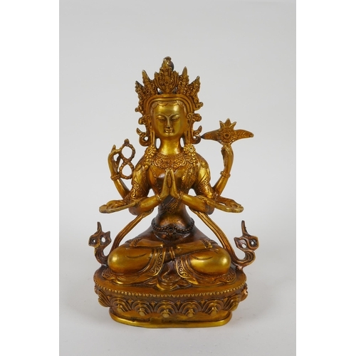 207 - A Tibetan gilt bronze figure of a female deity, double vajra mark to base, 21cm high