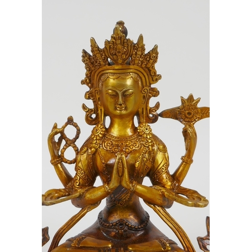 207 - A Tibetan gilt bronze figure of a female deity, double vajra mark to base, 21cm high