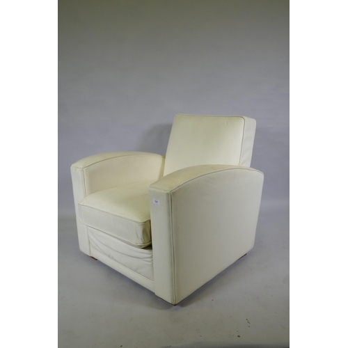 1131 - A contemporary club style armchair with leatherette cover