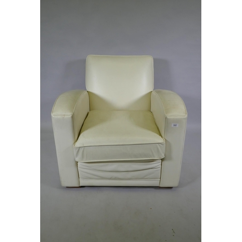 1131 - A contemporary club style armchair with leatherette cover