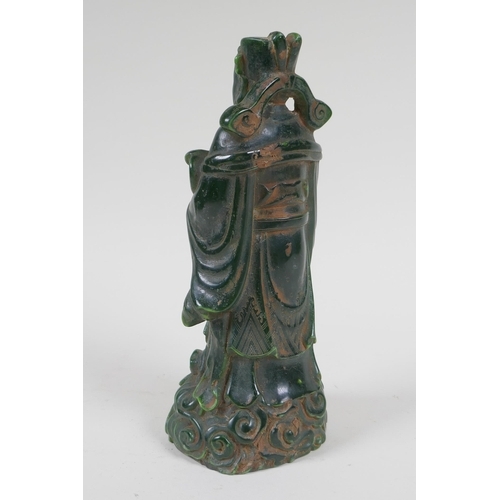 210 - A Chinese moulded green glass figure of an immortal, 20cm high