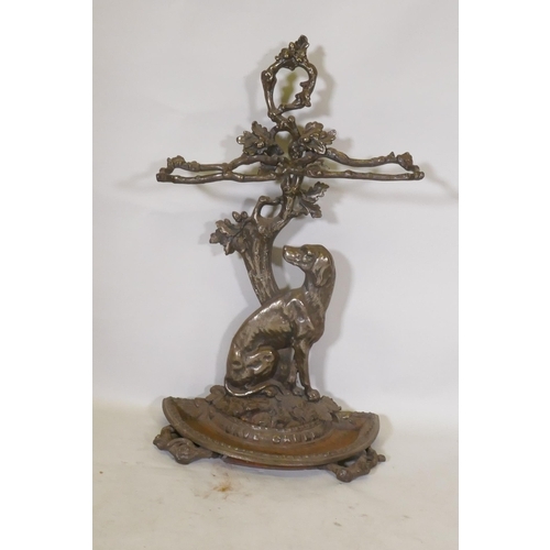 1119 - A Victorian style cast iron stick stand in the form of a seated dog with the legend Cave Canem, 75cm... 