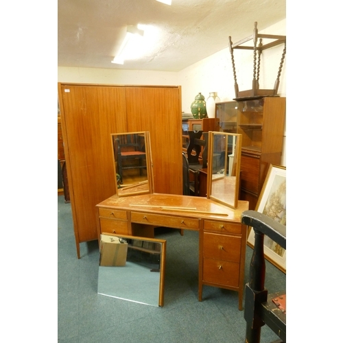 1109 - A mid century Loughborough teak wardrobe (dismantles) and matching dressing table with triple mirror... 