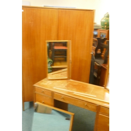 1109 - A mid century Loughborough teak wardrobe (dismantles) and matching dressing table with triple mirror... 