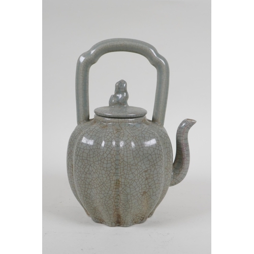 226 - A Chinese celadon crackleware teapot in the form of a gourd, 22cm high