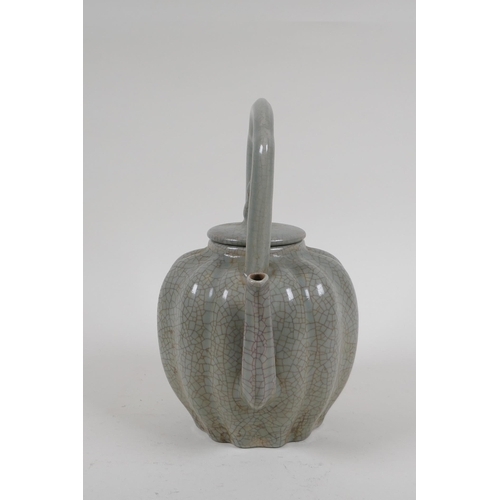 226 - A Chinese celadon crackleware teapot in the form of a gourd, 22cm high