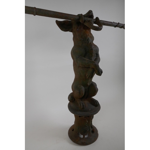 1088 - A Victorian cast iron stick stand formed as a dog on its hind legs, after Coalbrookdale, losses, 55c... 