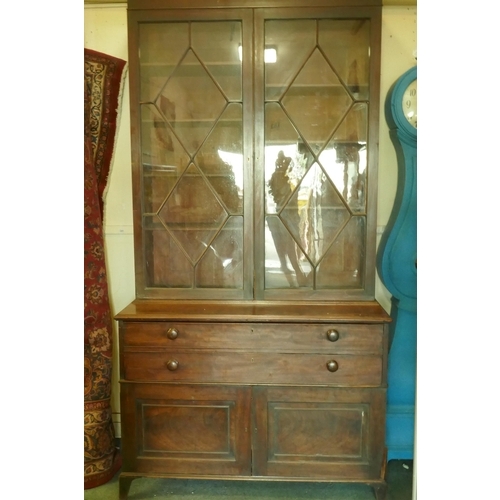 1086 - A Regency mahogany secretaire bookcase/estate cabinet, the upper section with two astragal glazed do... 