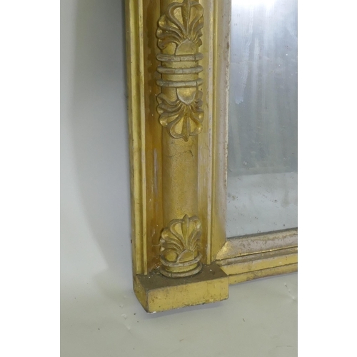 1063 - A Regency giltwood and composition over mantel mirror with anthemion decoration and original glass p... 