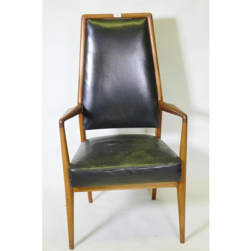 1059 - A set of three mid century teak boardroom elbow chairs with leather upholstered seats and backs