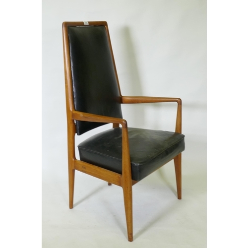 1059 - A set of three mid century teak boardroom elbow chairs with leather upholstered seats and backs