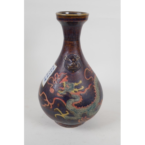 245 - A Chinese polychrome porcelain pear shaped vase with two lion mask handles and incised dragon decora... 