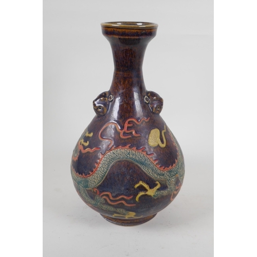 245 - A Chinese polychrome porcelain pear shaped vase with two lion mask handles and incised dragon decora... 